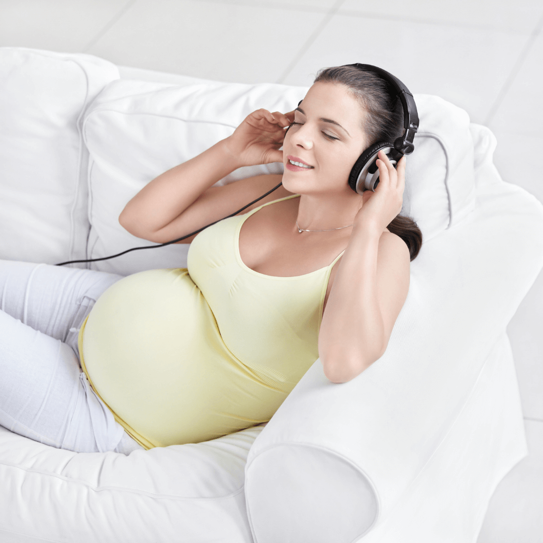 a mom listening something through her headphone