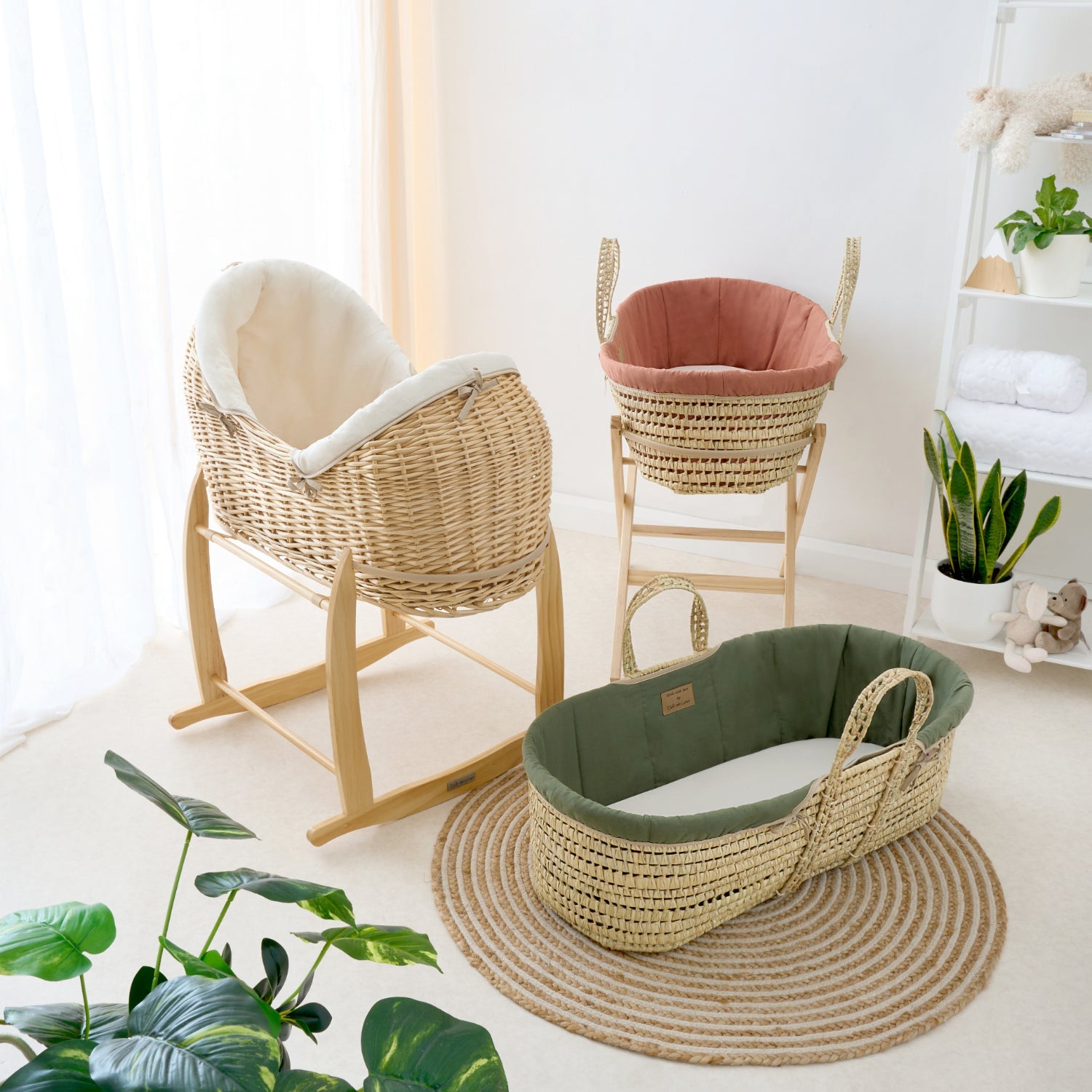 Rust Organic Moses Basket, Forest Green Organic Palm Moses basket and cream natural Noah Pod on rocking stands in neutral nursery | Bassinets | Nursery Furniture - Clair de Lune UK