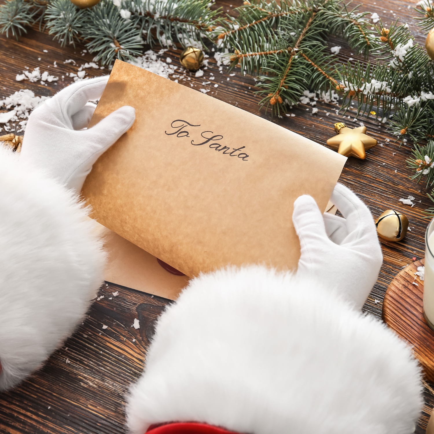 Santa's hands holding a child's letter that has been posted to the North Pole | Family Christmas - Clair de Lune UK