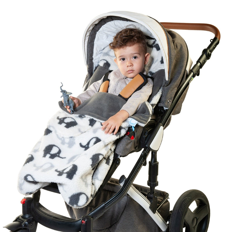 Happy baby in the Elephant Stomp Buggysnuggle Snuggle Sherpa™ Footmuff | Pushchair Cosytoes & Footmuffs | Travel Accessories - Clair de Lune UK