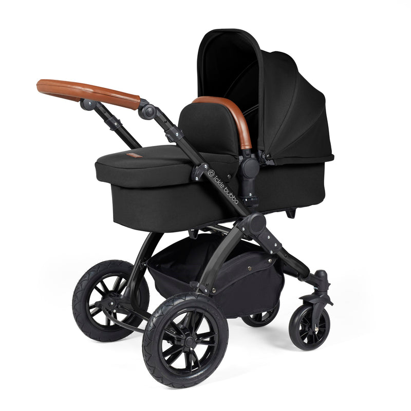 The carrycot of the Midnight Ickle Bubba Stomp Luxe All In One I Size Travel System With ISOFIX Base with the black chassis | Pushchairs and Travel Systems | Baby & Kid Travel - Clair de Lune UK