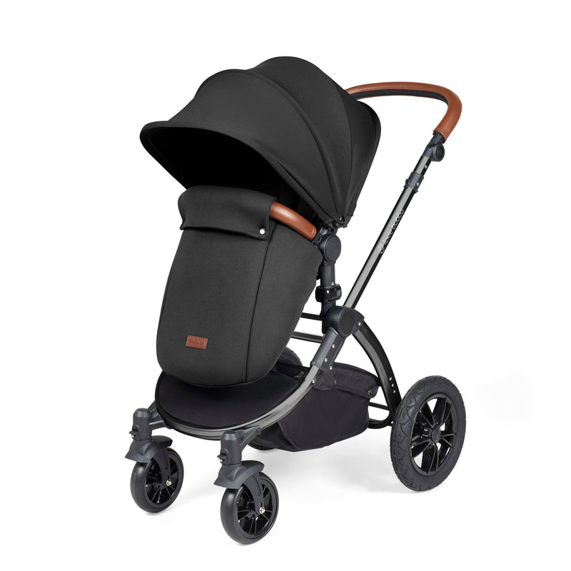 The pushchair and footmuff of the Midnight Ickle Bubba Stomp Luxe All In One I Size Travel System With ISOFIX Base with the black chassis | Pushchairs and Travel Systems | Baby & Kid Travel - Clair de Lune UK