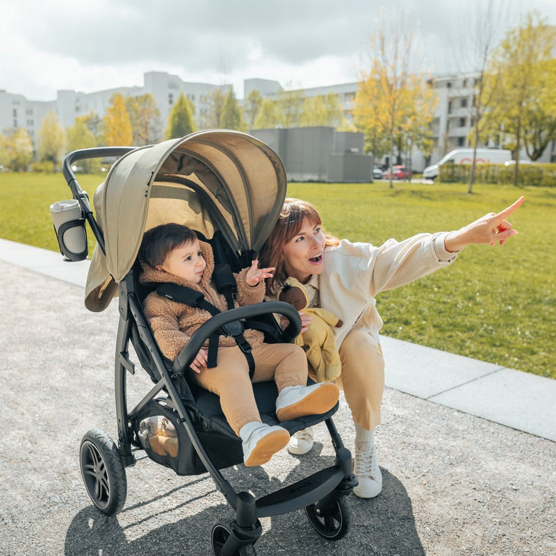 Mum next to her son sitting on the Green Hauck Rapid 4D Pushchair | Strollers | Pushchairs, Carrycots & Car Seats Baby | Travel Essentials - Clair de Lune UK