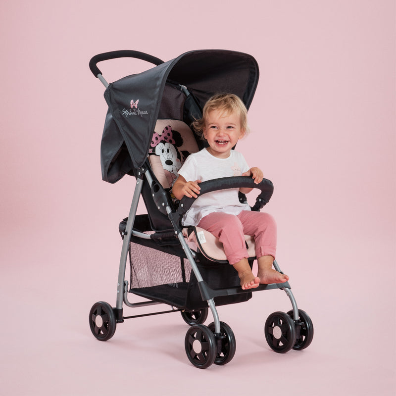 Toddler sitting on her pink Minnie Sweetheart Hauck Disney Sport Pushchair | Strollers, Pushchairs & Prams | Pushchairs, Carrycots & Car Seats Baby | Travel Essentials - Clair de Lune UK