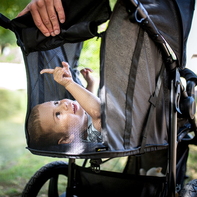 Baby seeing things around her through the breathable mesh window of the Black Hauck Runner 2 Pushchair | Strollers | Pushchairs, Carrycots & Car Seats Baby | Travel Essentials - Clair de Lune UK
