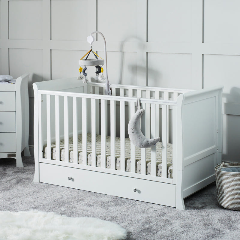 Ickle Bubba Snowdon Classic Cot Bed with the cot mobile in a gender-neutral nursery room | Cots, Cot Beds & Toddler Beds | Nursery Furniture - Clair de Lune UK