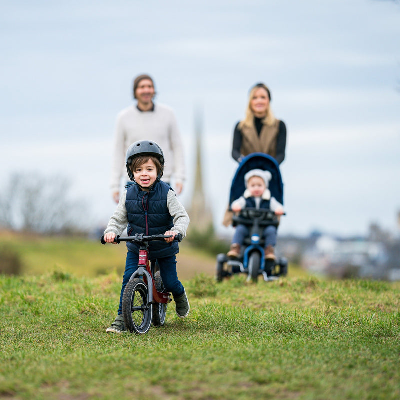 Family enjoying the English countryside with the son riding his Bentley Balance Bike and the mum pushing her Bentley Tribike | Toddler Bikes | Montessori Activities For Babies & Kids - Clair de Lune UK