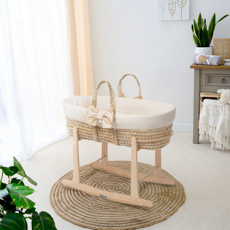 Cream 80th Anniversary Chelsea Palm Moses Basket on the Natural Standard Rocking Stand in a Scandi gender-neutral nursery | Moses Baskets and Stands | Co-sleepers | Nursery Furniture - Clair de Lune UK