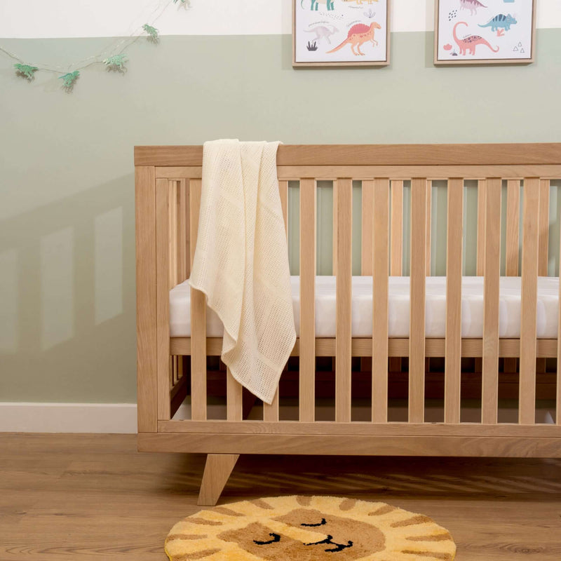 The oak details of the Oak Cot Bed | Cots, Cot Beds, Toddler & Kid Beds | Nursery Furniture - Clair de Lune UK