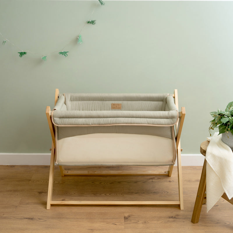 Sage Green Organic Folding Crib in front of a Scandi Sage Green wall | Bedside & Folding Cribs | Next To Me Cots & Newborn Baby Beds | Co-sleepers - Clair de Lune UK