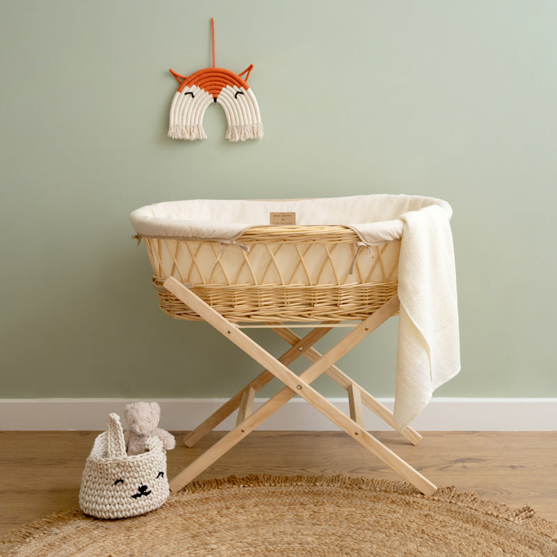 Cream Organic Natural Wicker Moses Basket on the Natural Folding Stand in a Sage Green Scandi nursery room | Moses Baskets | Co-sleepers | Nursery Furniture - Clair de Lune UK