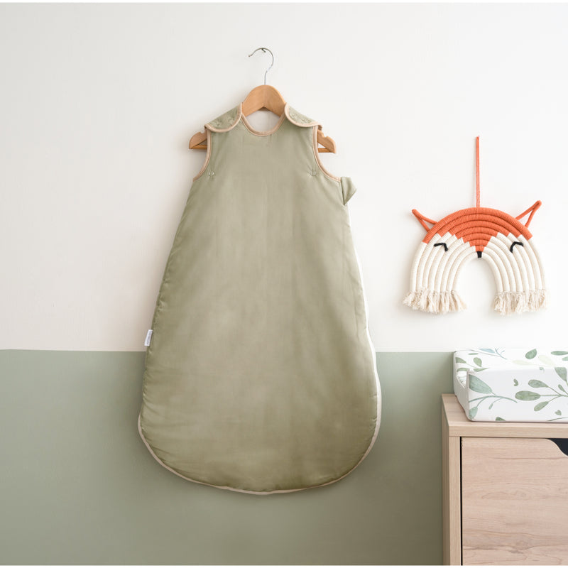 Sage Green Organic Sleeping Bag (0-6 Months) on a wall-mount hanger in a Scandi Sage Green nursery | Baby Sleep Bags, Shawls, Swaddles & Sleepbags | Nightwear | Nursery - Clair de Lune UK