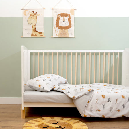 The lifestyle setting of the Reversible Jungle Dream Cot Bed Duvet Cover and Pillowcase Set | Bedding - Clair de Lune UK