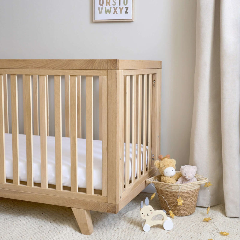 Sturdy Oak Cot Bed in a Scandi Natural Nursery Room | Cots, Cot Beds, Toddler & Kid Beds | Nursery Furniture - Clair de Lune UK