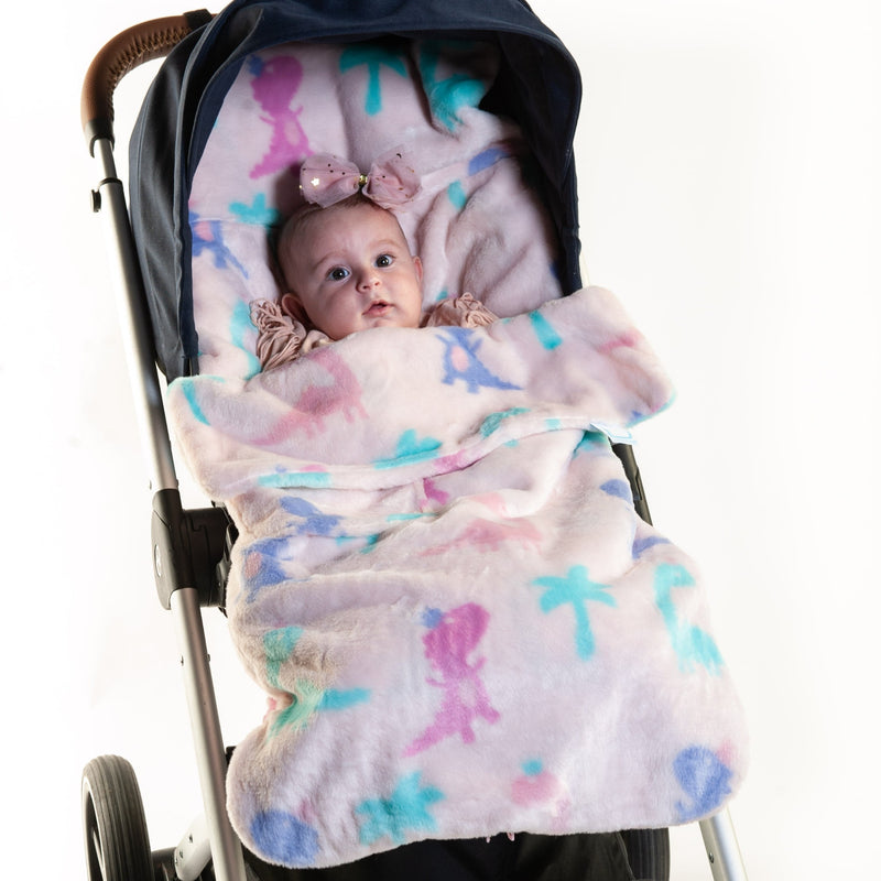 Baby snuggling in the Jurassic Jubilee Buggysnuggle Snuggle Fur Footmuff | Pushchair Cosytoes & Footmuffs | Travel Accessories - Clair de Lune UK