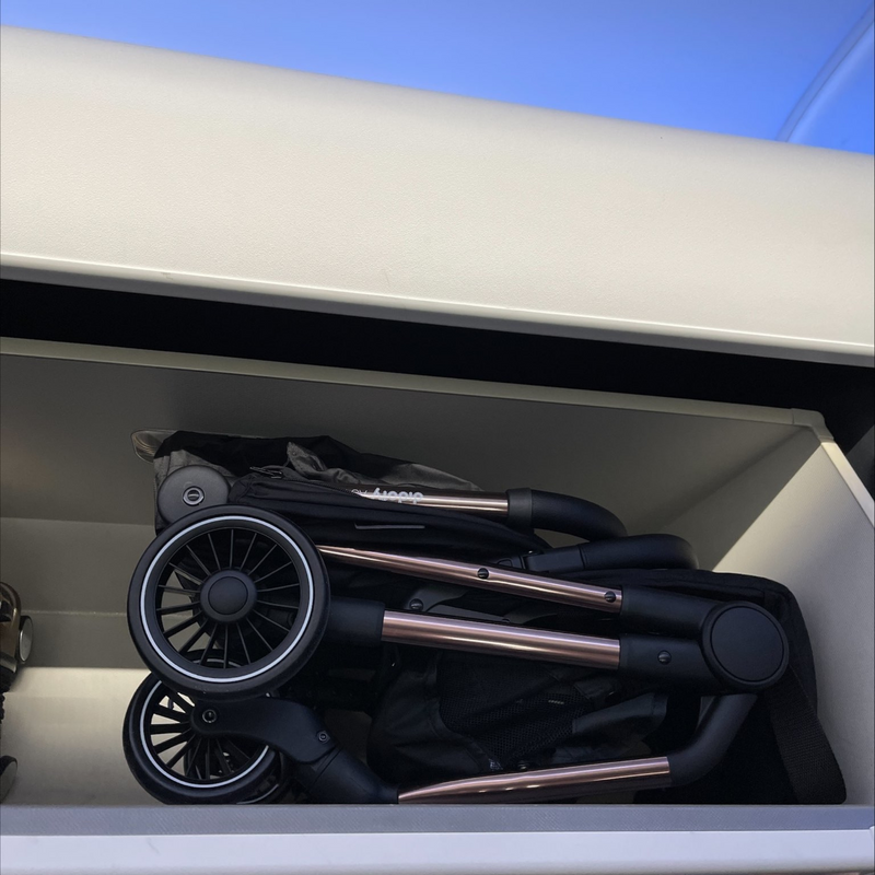  Folded Didofy Black New Aster 2 Ultra-Compact Pushchair & Travel System on the overhead bin of an airplane as a carryon | Strollers, Pushchairs & Prams | Pushchairs, Carrycots & Car Seats Baby | Travel Essentials - Clair de Lune UK