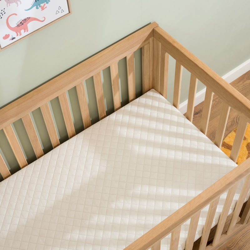 Essentials Hypoallergenic Fibre Cot Bed Mattress (140 x 70 cm) in the cot bed | Cot Bed Mattresses (140x70cm) | Baby & Toddler Mattresses | Bedding | Nursery Furniture - Clair de Lune UK