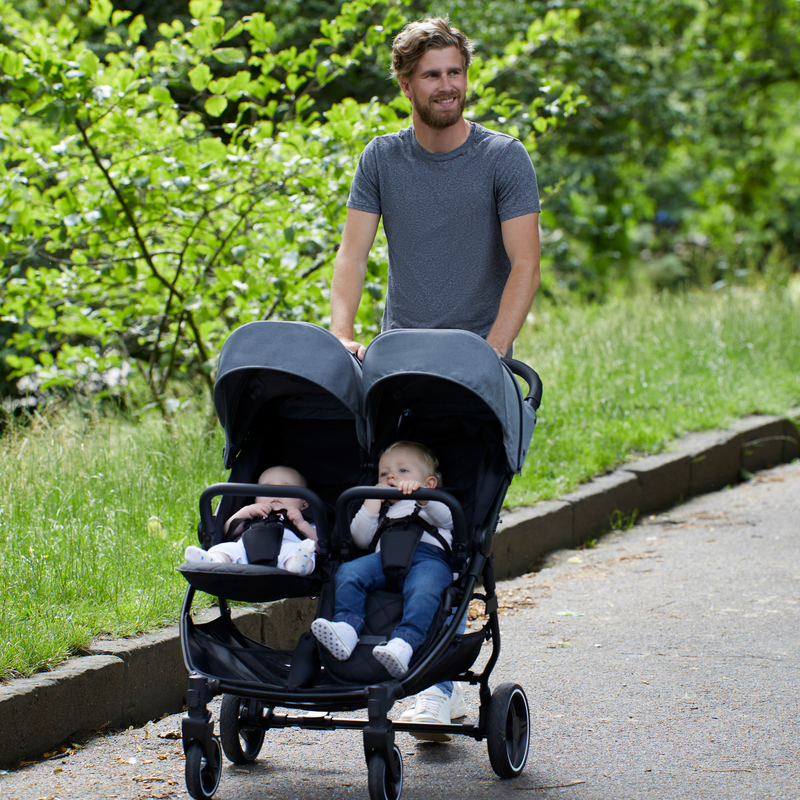 Dad pushing his Grey Ickle Bubba Venus Prime Double Stroller | Buggies, Strollers & Pushchairs | Travel With Your Baby - Clair de Lune UK