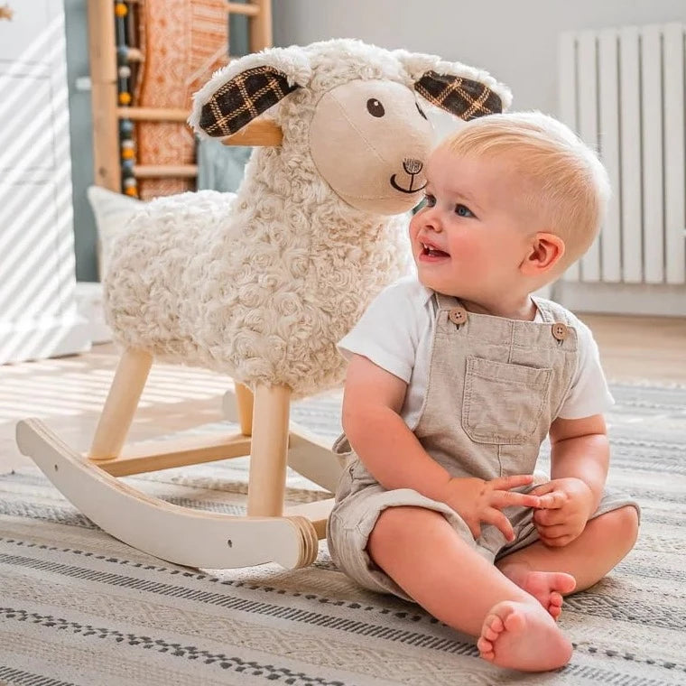 Toddler boy next to his favourite gift Little Bird Told Me Lambert Rocking Sheep | Rocking Animals | Montessori Activities For Babies & Kids | Toys | Baby Shower, Birthday & Christmas - Clair de Lune UK
