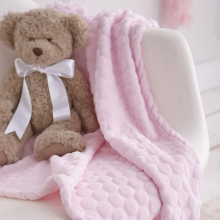 Pink Marshmallow blanket of the pink Baby Shower Gift Set on a white rocking nursing chair | Newborn Hampers | Baby Gift Sets | Baby Shower, Birthday & Christmas Gifts - Clair de Lune UK