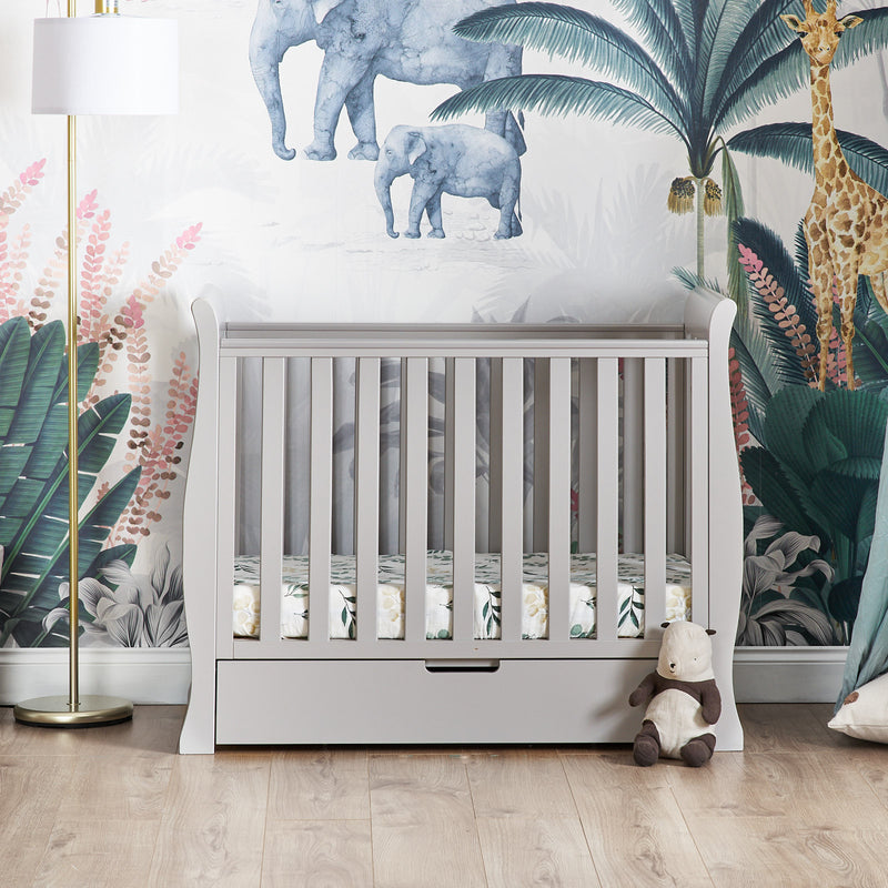 The warm grey Obaby Stamford Space Saver Cot in a jungle-inspired nursery room | Cots, Cot Beds, Toddler & Kid Beds | Nursery Furniture - Clair de Lune UK