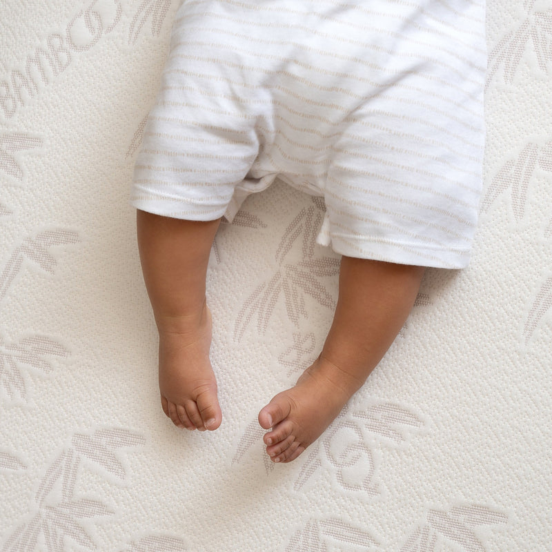 Baby sleeping on the Premium Bamboo Pocket Sprung Cot Bed Mattress (140 x 70 cm) | Cot Bed Mattresses (140x70cm) | Baby & Toddler Mattresses | Bedding | Nursery Furniture - Clair de Lune UK