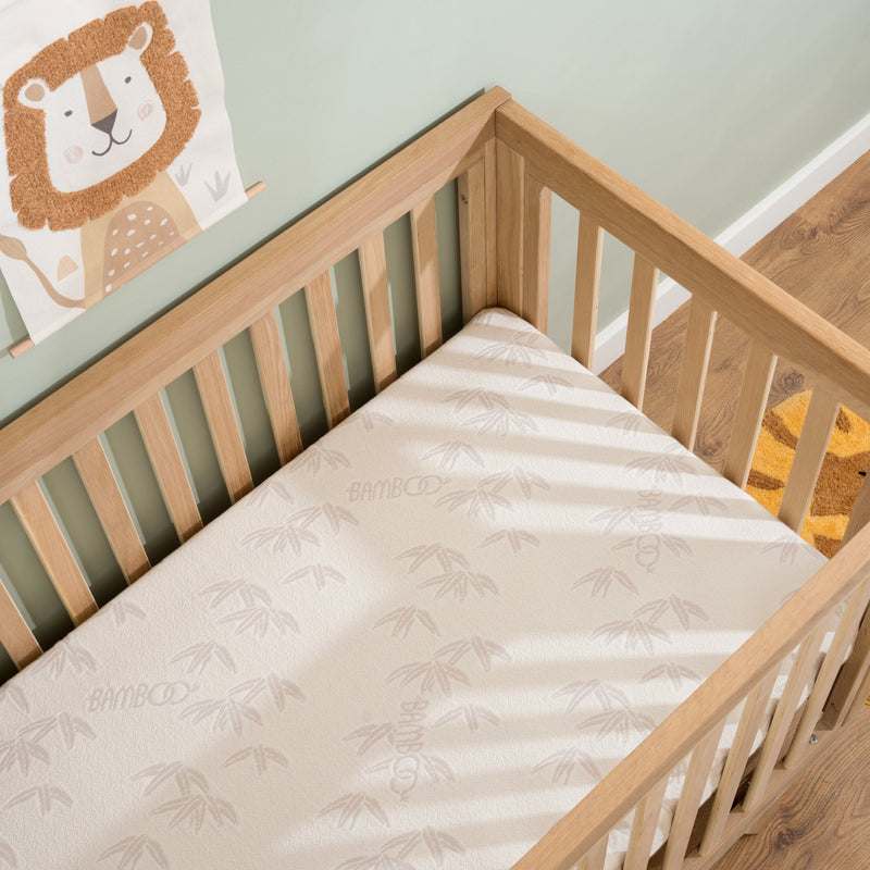 Premium Bamboo Pocket Sprung Cot Bed Mattress (140 x 70 cm) in a cot bed | Cot Bed Mattresses (140x70cm) | Baby & Toddler Mattresses | Bedding | Nursery Furniture - Clair de Lune UK