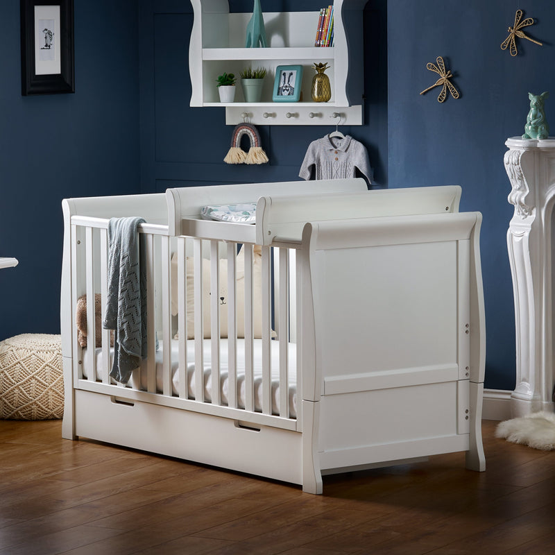 White Obaby Stamford Sleigh Cot Top Changer on the white Stamford Cot | Baby Changing Units, Tables & Cot Top Changers | Baby Bath Time - Clair de Lune UK