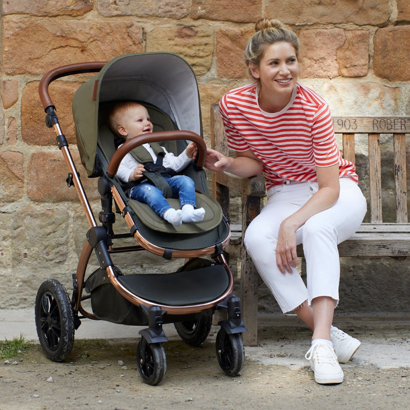 Mum sitting next to her baby sitting on the Woodland Green Ickle Bubba Stomp V4 2 in 1 Pushchair & Carrycot | Pushchairs and Travel Systems | Baby & Kid Travel - Clair de Lune UK