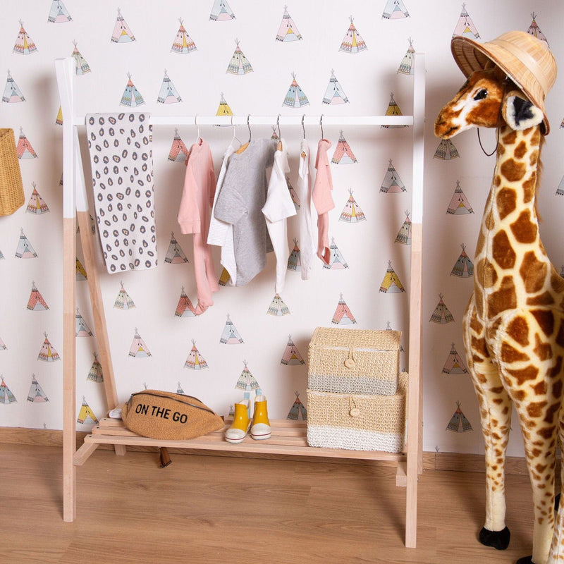 Baby clothes hung on the Natural Childhome Tipi Open Clothes Rack | Clothes Racks, Wardrobes & Shelves | Storage Solutions | Nursery Furniture - Clair de Lune UK