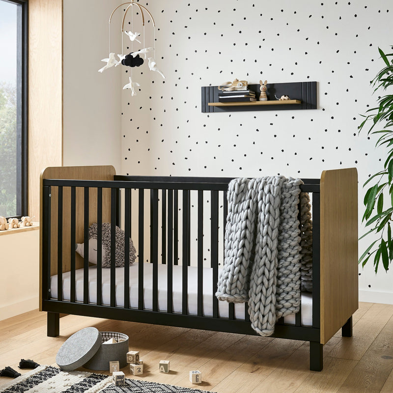 The cot bed of the Black and Natural CuddleCo Rafi Nursery Room Sets in a monochrome style nursery furniture room | Nursery Furniture Sets | Room Sets | Nursery Furniture - Clair de Lune UK