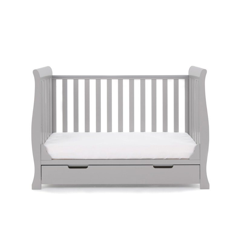 The cot bed of the warm grey Obaby Stamford Mini Sleigh Cot & Changing Unit without a side wall | Nursery Furniture Sets | Room Sets | Nursery Furniture - Clair de Lune UK