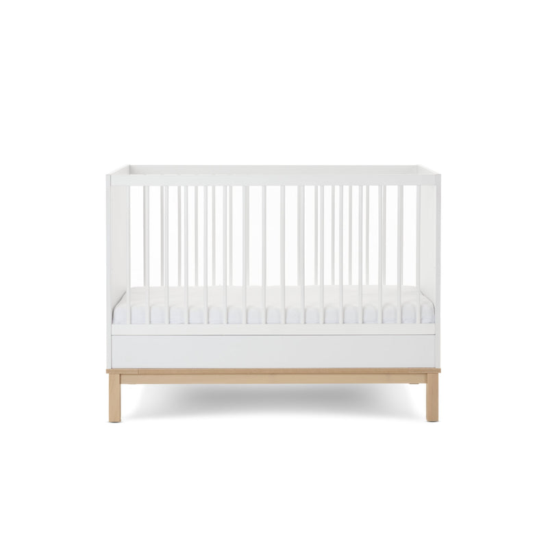 The white and natural Obaby Astrid Mini Cot Bed with an adjustable platform at the lowest level | Cots, Cot Beds, Toddler & Kid Beds | Nursery Furniture - Clair de Lune UK