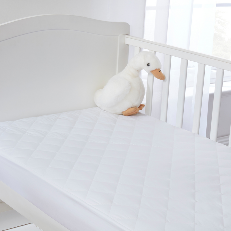 Micro-Fresh® Quilted Cot Bed Mattress Protector on a cot bed mattress | Soft Baby Sheets | Cot, Cot Bed, Pram, Crib & Moses Basket Bedding - Clair de Lune UK