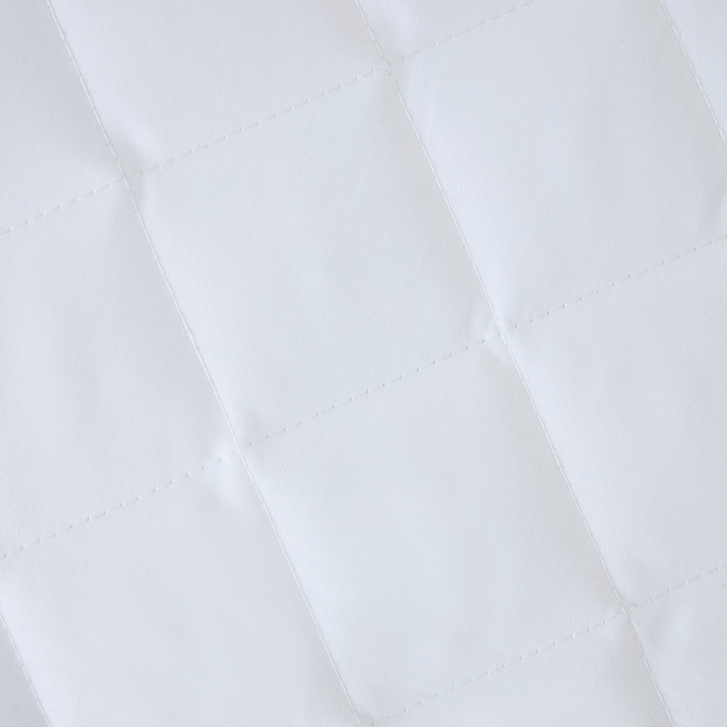 The quilted cover of the Micro-Fresh® Quilted Cot Bed Mattress Protector | Soft Baby Sheets | Cot, Cot Bed, Pram, Crib & Moses Basket Bedding - Clair de Lune UK