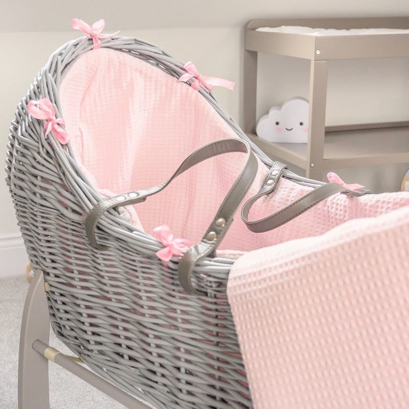 Pink Waffle Grey Wicker Noah Pod® on the Grey Deluxe Rocking Stand with the matching coverlet | Bassinets | Nursery Furniture - Clair de Lune UK