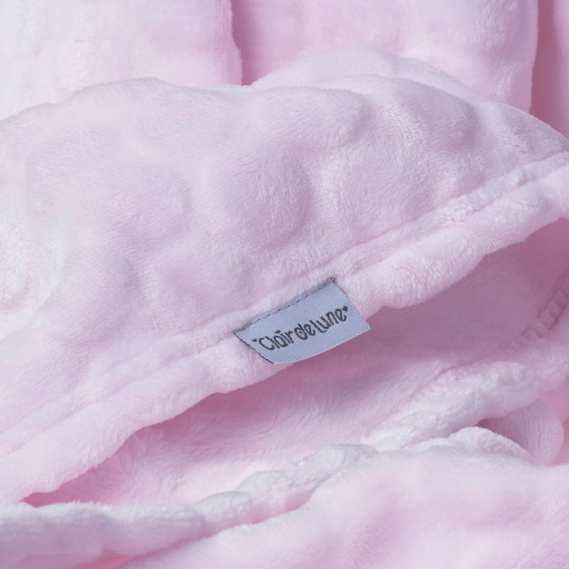 Showcasing the plush fabrics of the Pink Marshmallow Baby Blanket and the plain pink fabrics on the blanket's another side alongside the Clair de Lune brand label | Cosy Baby Blankets | Nursery Bedding | Newborn, Baby and Toddler Essentials - Clair de Lun