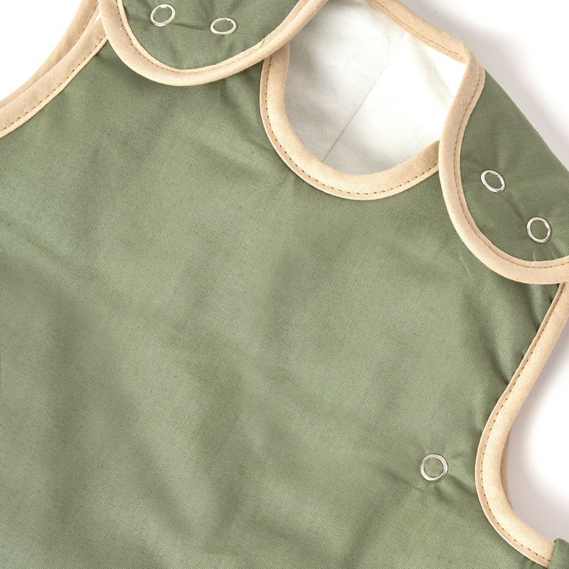 The matching biding detail and the button details of the Forest Green Organic Sleeping Bag (0-6 Months) | Baby Sleep Bags, Shawls, Swaddles & Sleepbags | Nightwear | Nursery - Clair de Lune UK