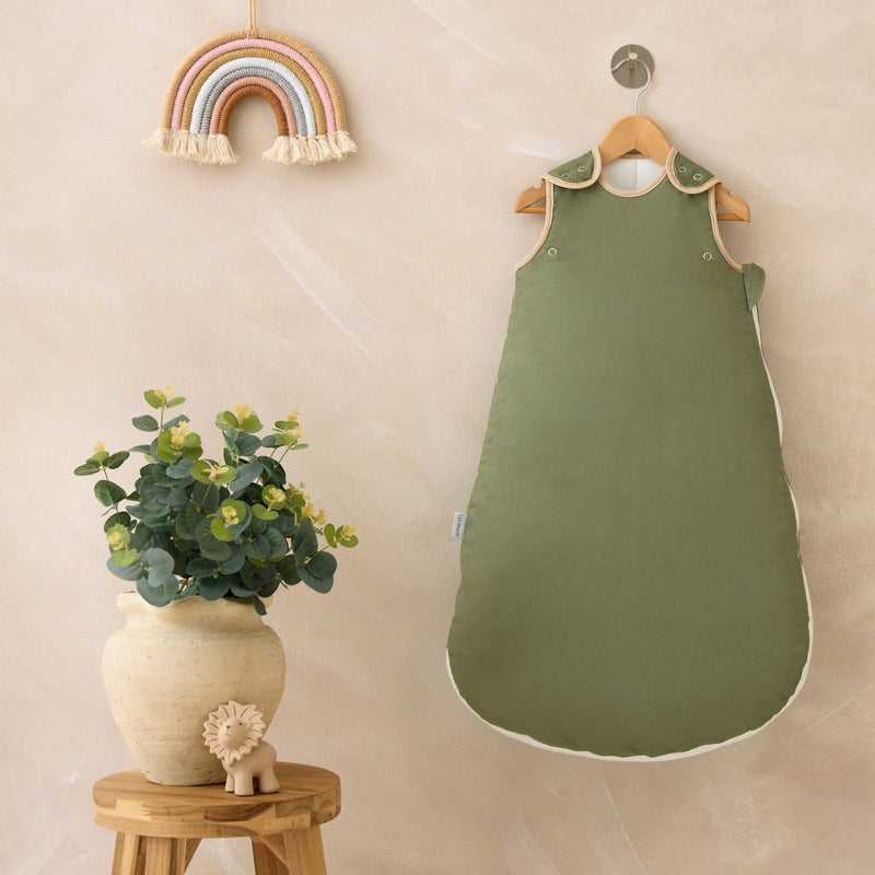 Forest Green Organic Sleeping Bag (0-6 Months) on a wall-mount hanger in a Scandi nursery | Baby Sleep Bags, Shawls, Swaddles & Sleepbags | Nightwear | Nursery - Clair de Lune UK