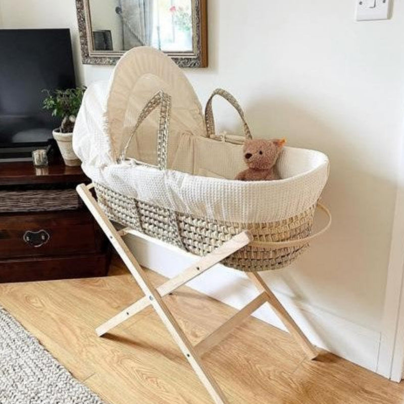 Cream Waffle Palm Moses Basket with the Clair de Lune Natural Compact Folding Moses Stand in a minimalist living room | Moses Baskets and Stands | Co-sleepers | Nursery Furniture - Clair de Lune UK