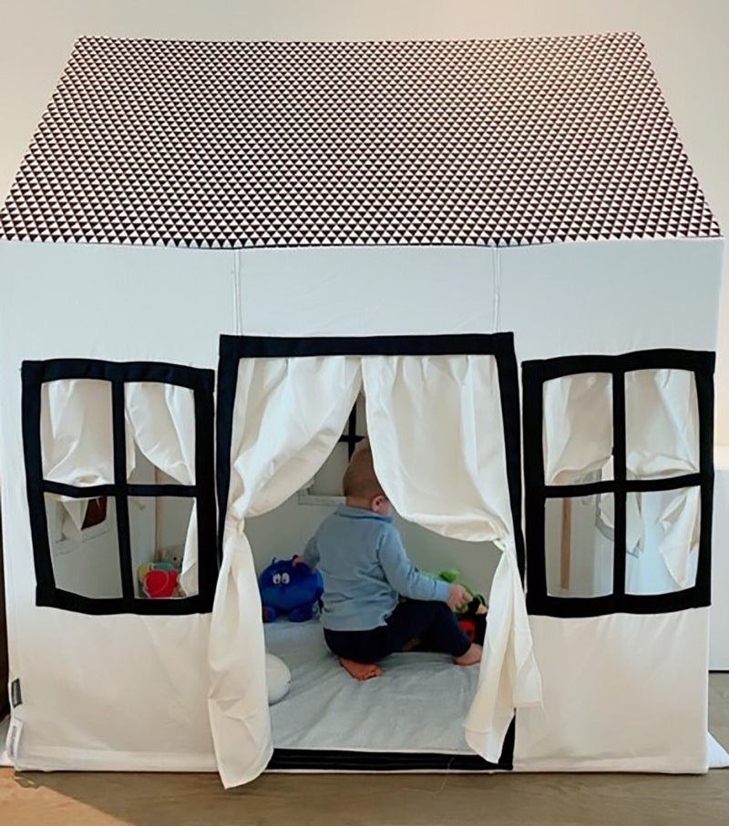 Kid playing in the Childhome Big Cotton Playhouse in a playroom | Nursery Storage | Nursery Furniture - Clair de Lune UK