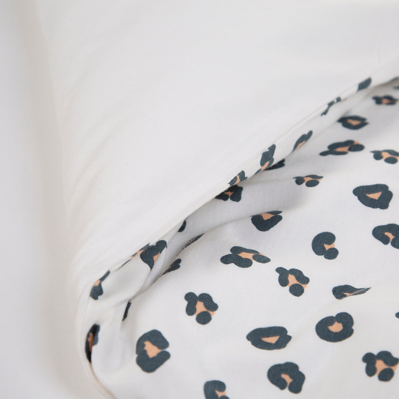 The white side and leopard side of the black leopard print of the Childhome Leopard Cot/Cot Bed Duvet Cover with Pillowcase | Toddler Bedding - Clair de Lune UK