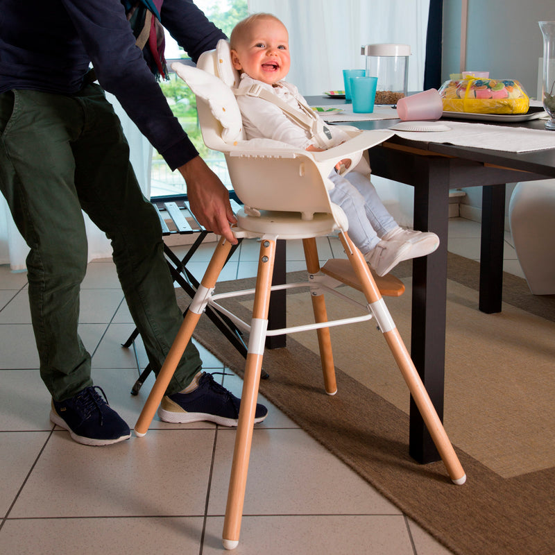 Happy toddler sitting on the Childhome Evolu One.80° Chair - 2 In 1 with Bumper | Highchairs | Feeding & Weaning - Clair de Lune UK