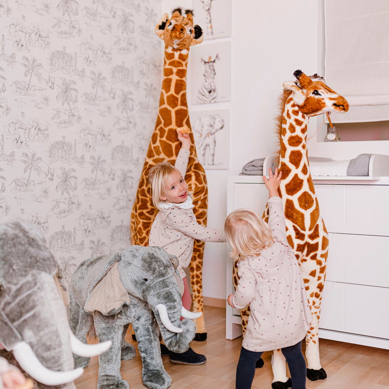 Sisters hugging their Childhome Standing Giraffes | Toys | Baby Shower, Birthday & Christmas Gifts - Clair de Lune UK
