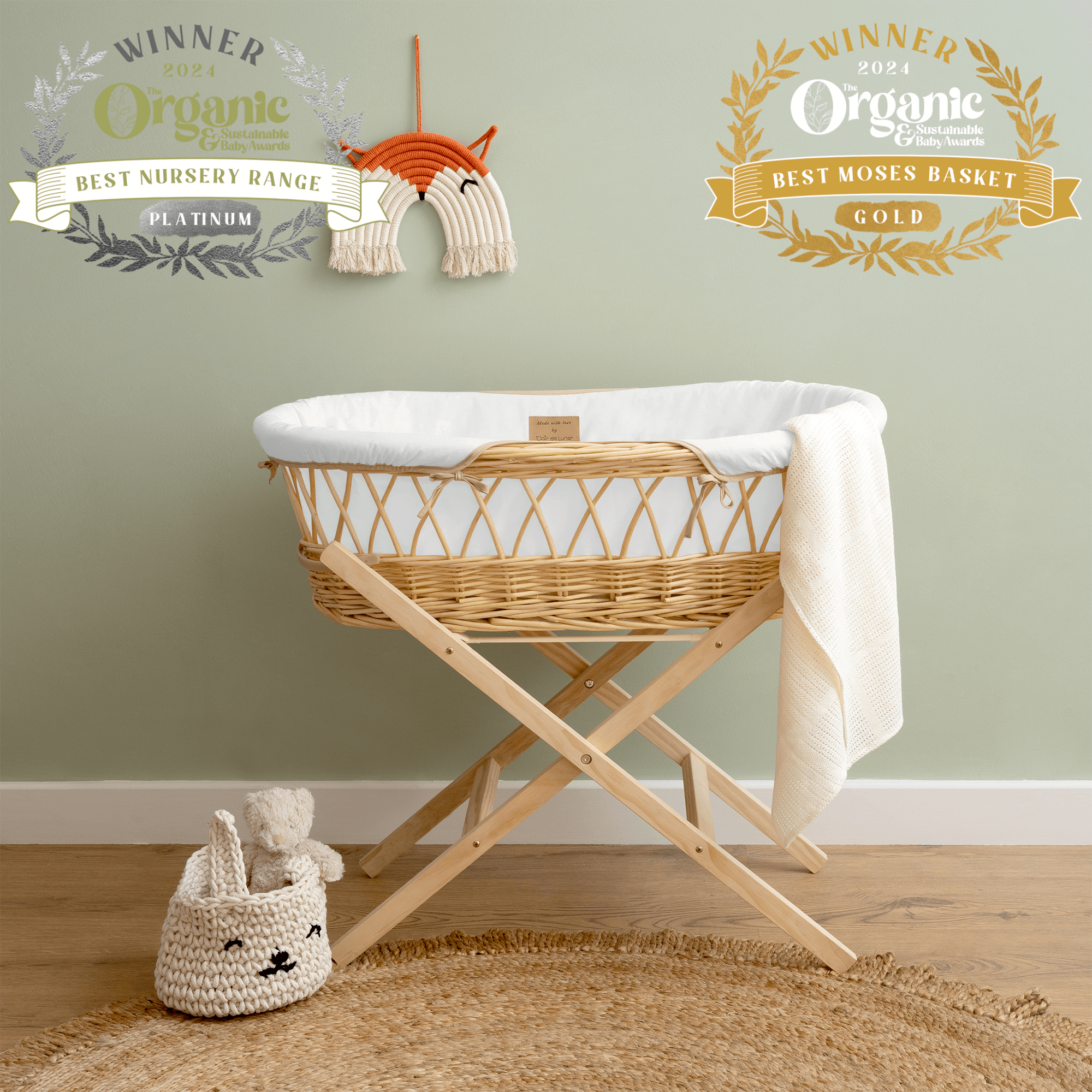 The Organic Natural Wicker Moses Basket in White in a Sage Nursery Showcasing the Organic & Sustainability Awards for the Best Nursery Range and Best Moses Basket Range | Bassinets | News - Clair de Lune UK