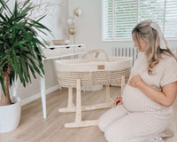 Pregnant mum to be with the Organic Knitted Palm Moses Basket from Clair de Lune