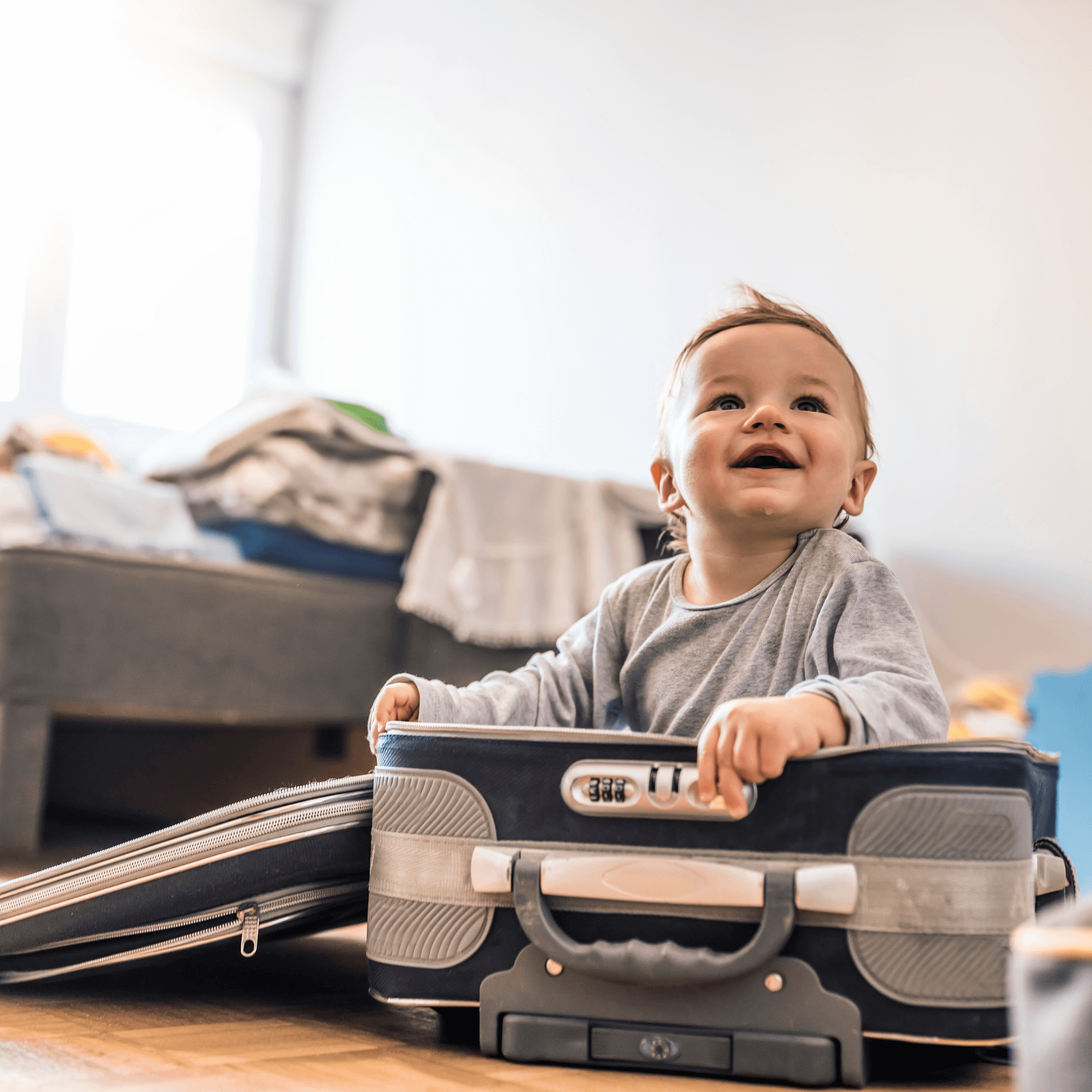 Cute smiling baby sat in a suitcase | Travel with Baby | Family Time - Clair de Lune UK