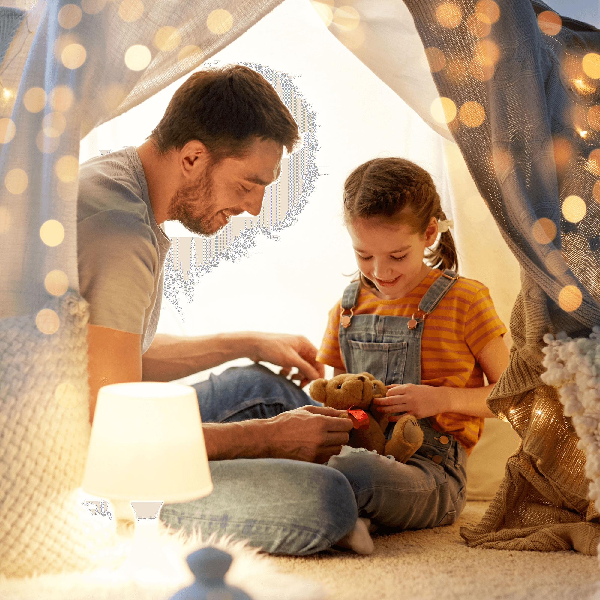 Dad and daughter sitting in a beautiful homemade den light up with fairy lights having a teddy bear's picnic | Family Time | Father's Day - Clair de Lune UK