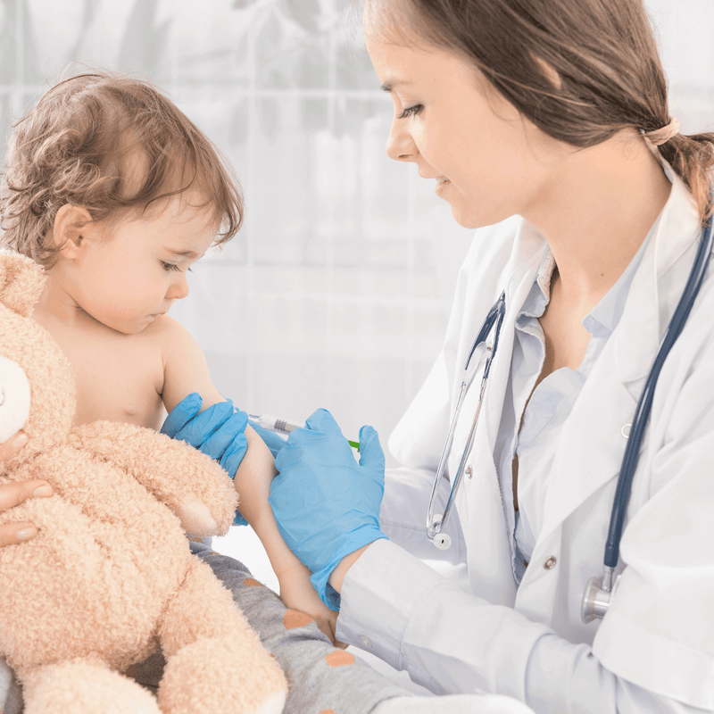 The Importance of Baby Vaccinations | Doctor administering vaccinations to a patient baby girl - Clair de Lune UK