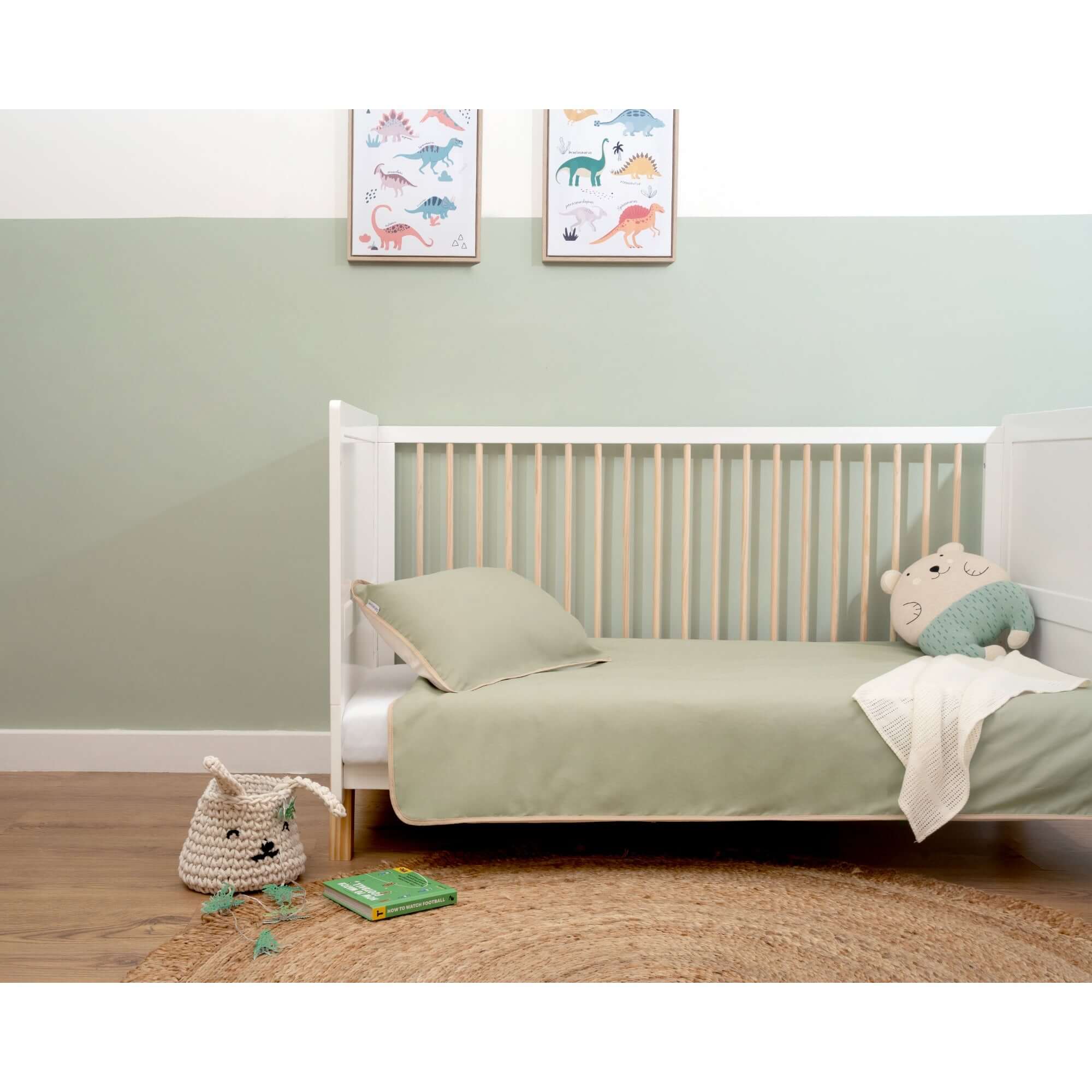 Organic Reversible Cot Bedding in Sage on the White Essentials Cot Bed in a neutral green nursery | Baby Essentials | Buying Guides - Clair de Lune UK